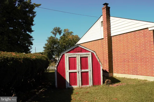 a view of backyard with swimming pool and porch