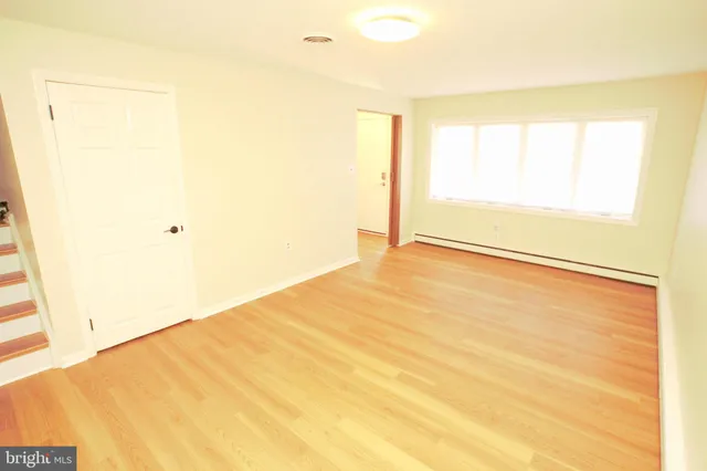 a view of an empty room and window