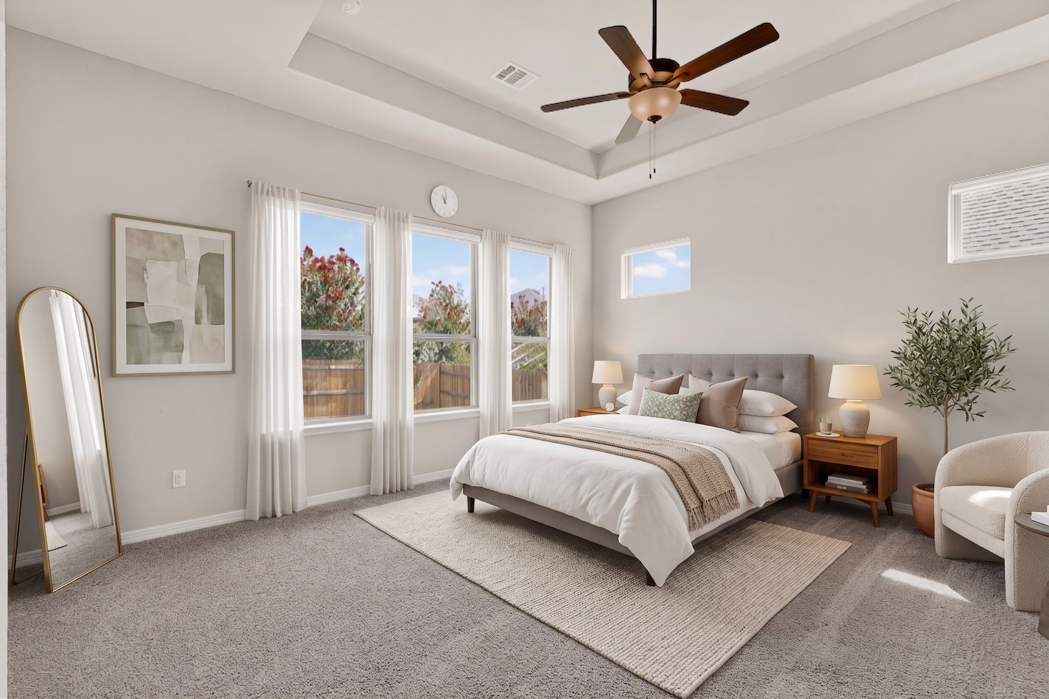 2433 La Mirada Street Leander, TX 78641 - Photo 7 of 25 Elegant primary bedroom offers multiple windows and a large ceiling fan for ultimate comfort.