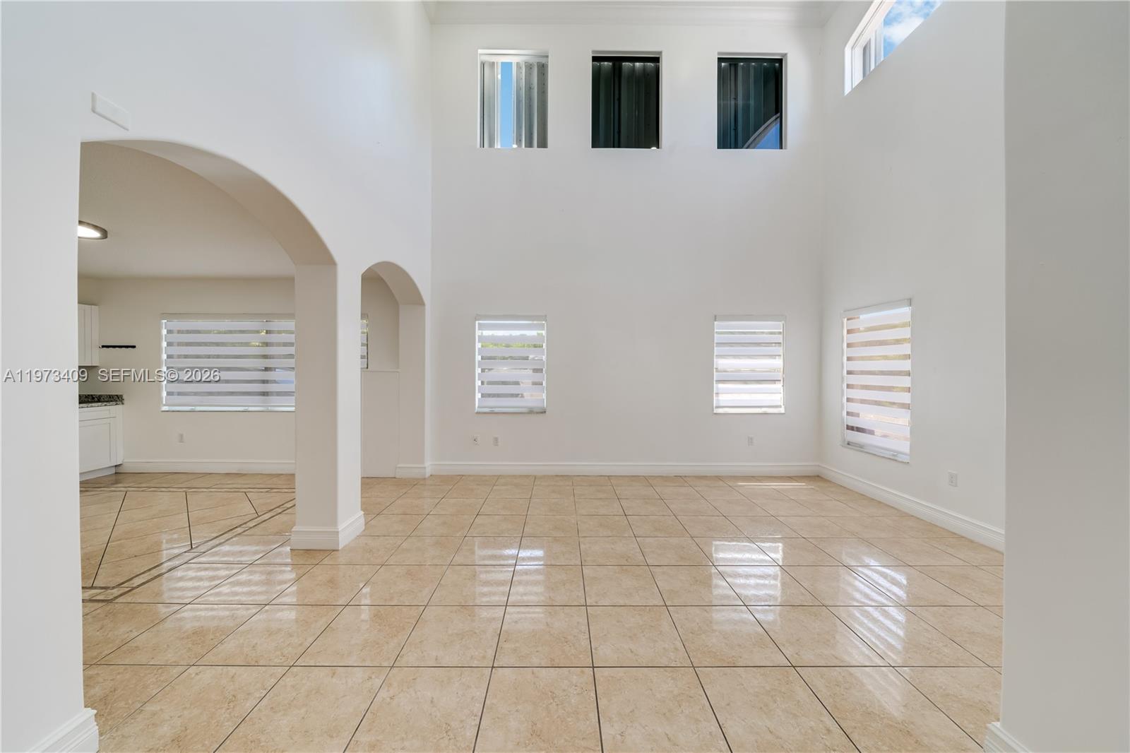 13050 Southwest 26th Street Miami, FL 33175 - Photo 9 of 43 a view of an empty room with a window