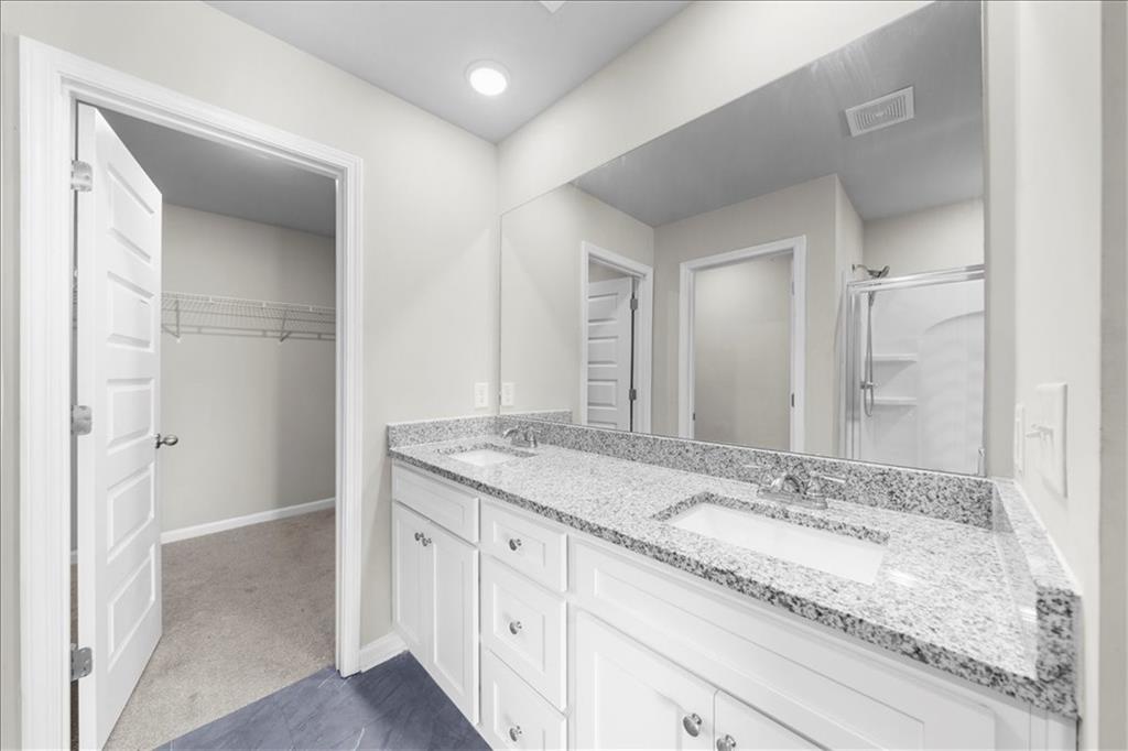 300 Harrison Street Calhoun, GA 30701 - Photo 16 of 17 a bathroom with a granite countertop sink and a mirror