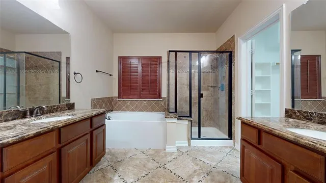 a bathroom with a tub sink and mirror