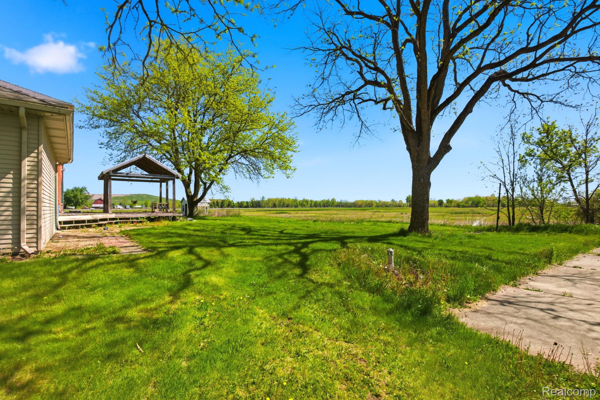 14104 Carleton West Road Carleton, MI 48117 - Photo 44 of 58 View of green lawn