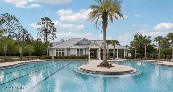 a swimming pool with outdoor seating and yard