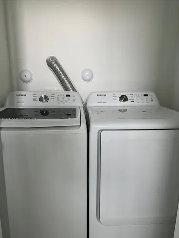 a utility room with dryer and washer