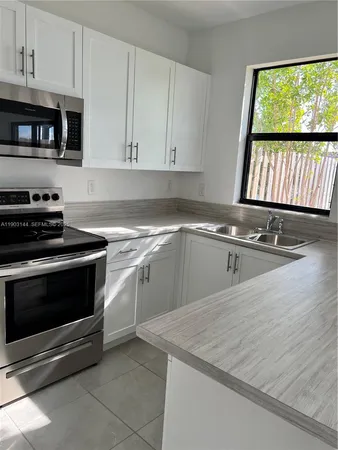 a bathroom with a toilet a sink and a mirror