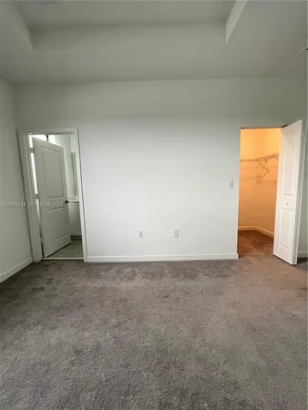 a bathroom with a shower sink vanity and toilet