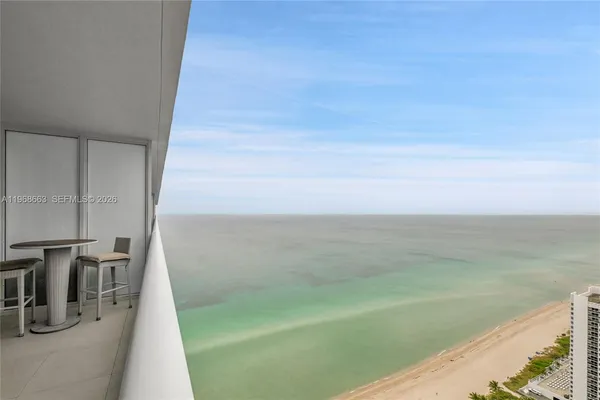 a view of a balcony with an outdoor space
