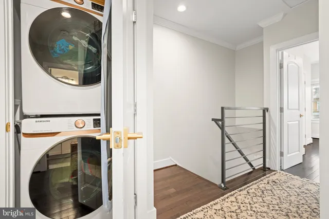 a view of a hallway with washer and dryer