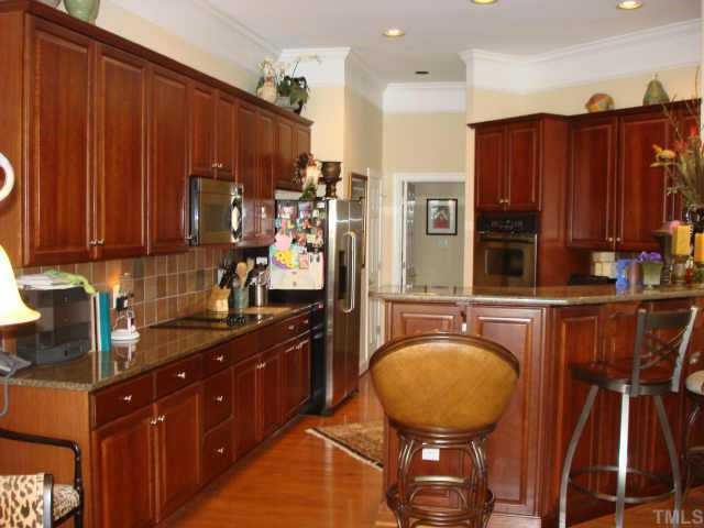 12604 Bellstone Lane Raleigh, NC 27614 - Photo 2 of 10 Lovely upgraded kitchen with granite counters,Cherrywood and a tile backsplash Other