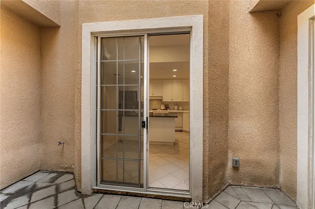 a bathroom with a glass shower door