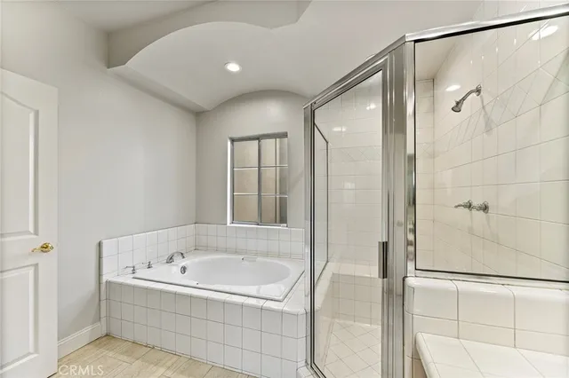 a bathroom with a bathtub and shower