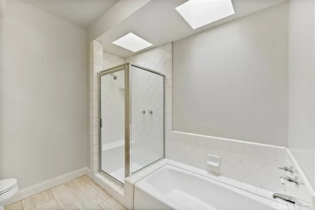 a bathroom with a tub and shower