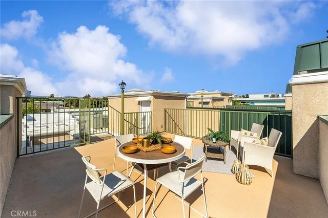 a view of a chairs and table in the patio