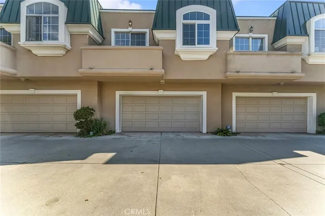 a front view of a house with parking