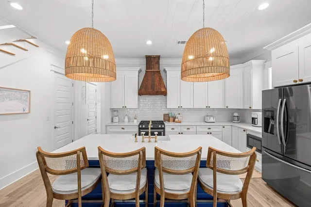 a room with pool table and windows