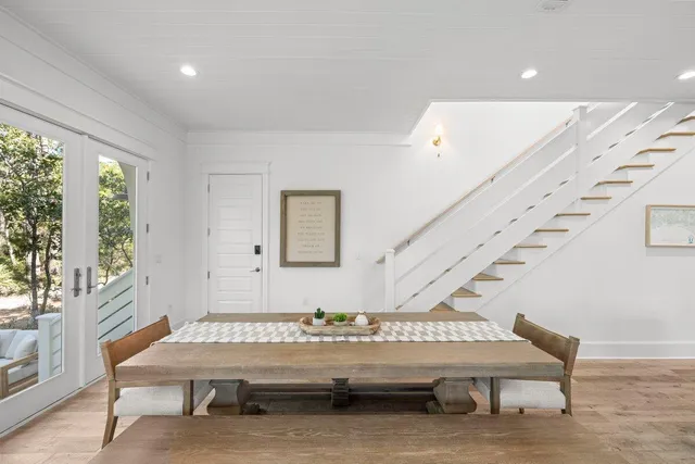 a bedroom with two beds and a flat screen tv