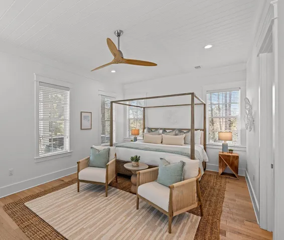 a living room with furniture and windows