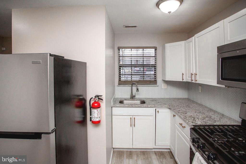 35 Via Cascata Drive Clementon, NJ 08021 - Photo 13 of 43 a utility room with cabinets washer and dryer