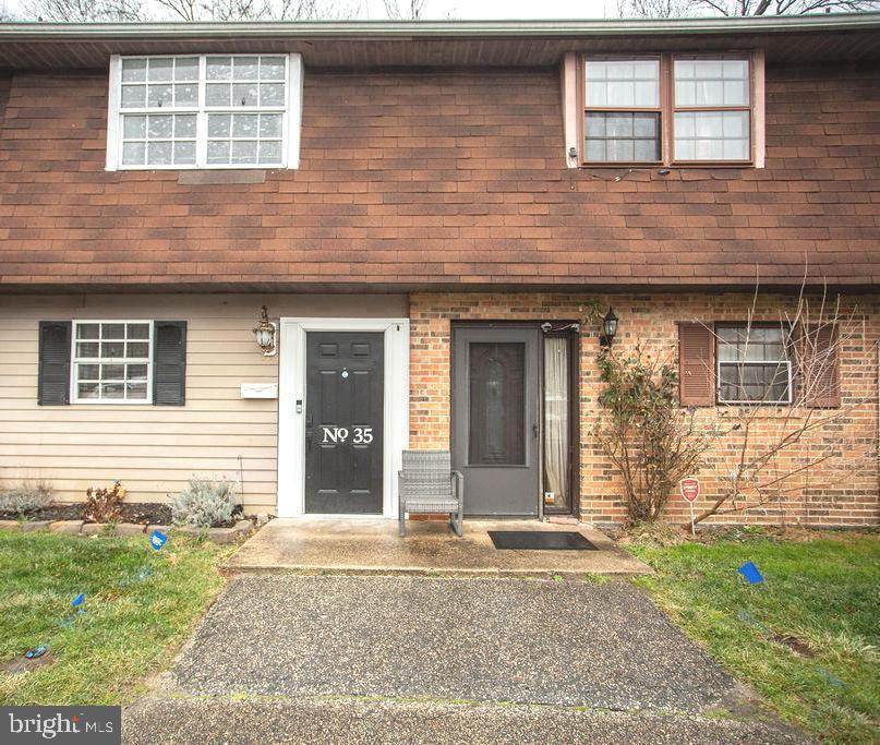 35 Via Cascata Drive Clementon, NJ 08021 - Photo 2 of 43 a view of a brick house with a yard and large tree