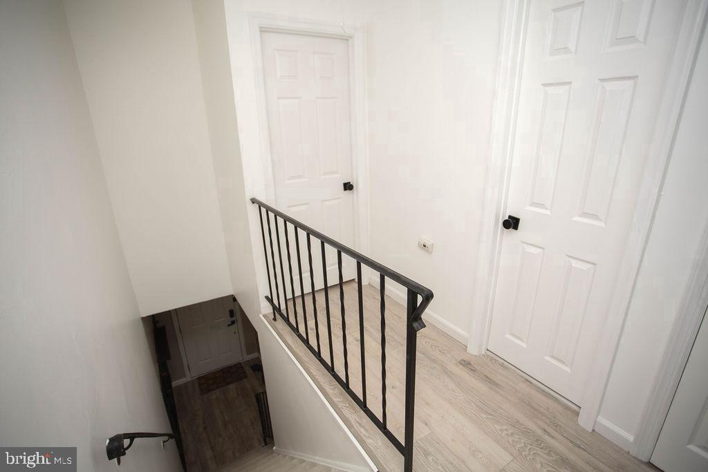 35 Via Cascata Drive Clementon, NJ 08021 - Photo 23 of 43 a view of a hallway with wooden floor and staircase