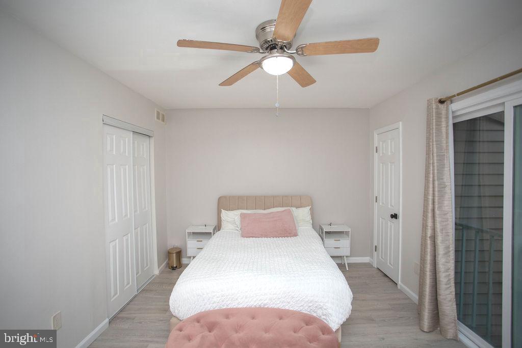 35 Via Cascata Drive Clementon, NJ 08021 - Photo 25 of 43 a bedroom with a white bed and a chandelier