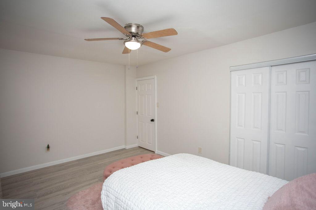 35 Via Cascata Drive Clementon, NJ 08021 - Photo 27 of 43 a bedroom with a bed and a chandelier