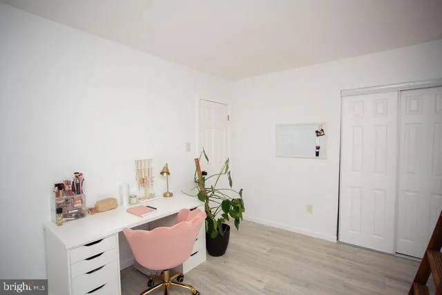 a view of a workspace with furniture