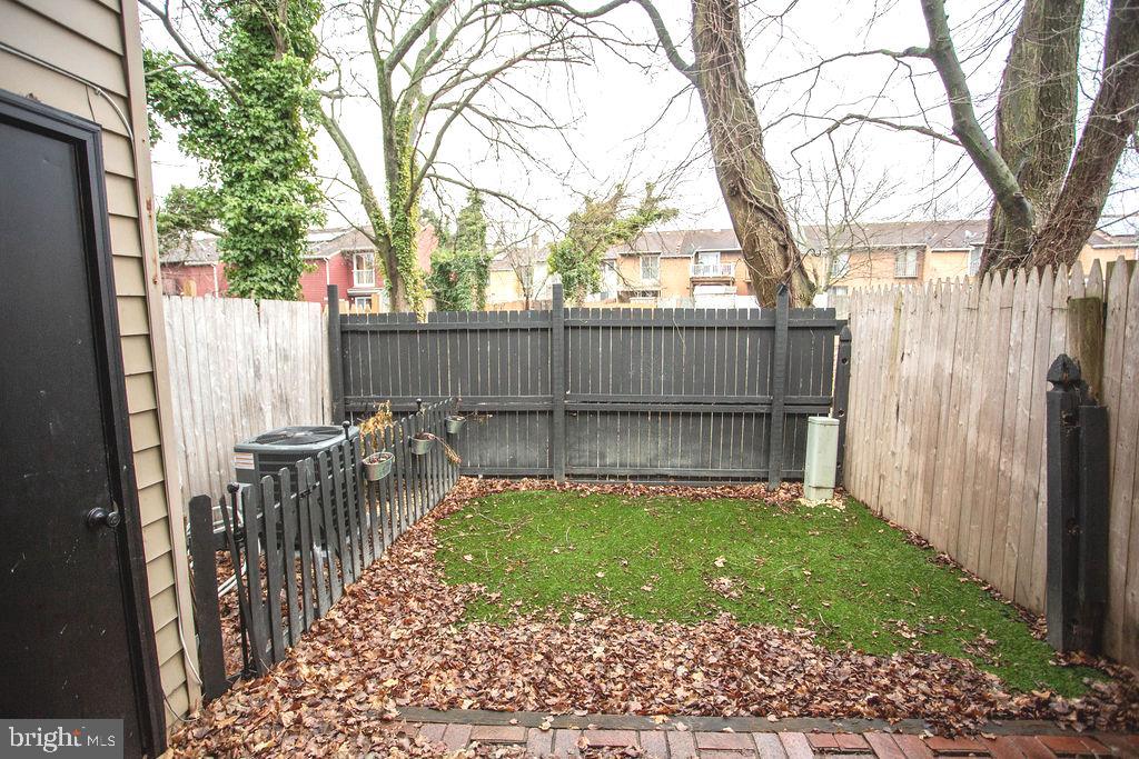 35 Via Cascata Drive Clementon, NJ 08021 - Photo 38 of 43 a view of a backyard with a small pool and wooden fence