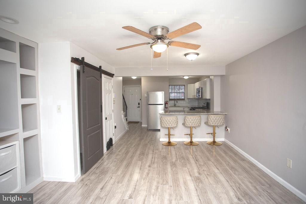 35 Via Cascata Drive Clementon, NJ 08021 - Photo 7 of 43 a living room with stainless steel appliances furniture and a kitchen view