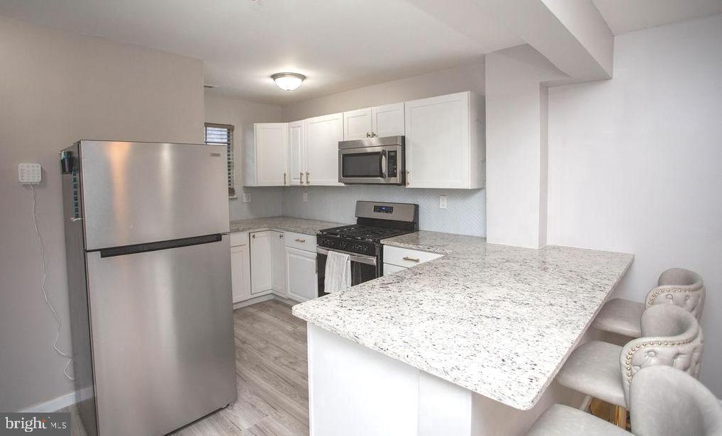 35 Via Cascata Drive Clementon, NJ 08021 - Photo 10 of 43 a kitchen with a refrigerator a stove a sink and a refrigerator