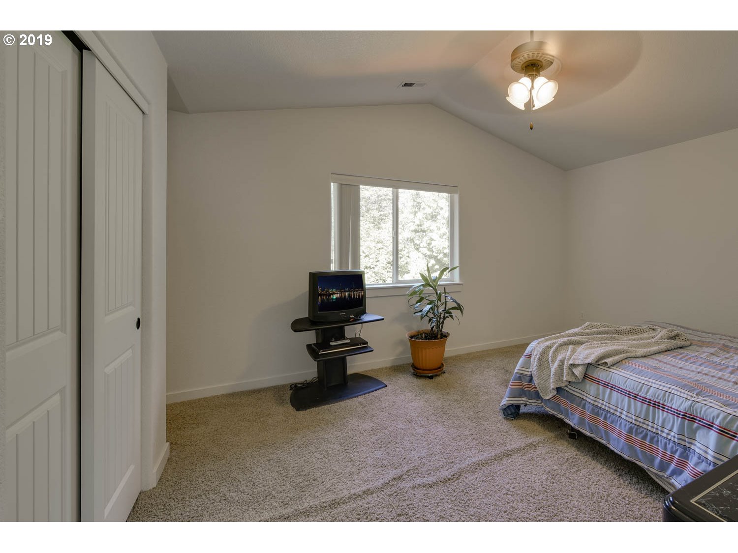 39573 Dubarko Road Sandy, OR 97055 - Photo 11 of 18 a bedroom with bed and window