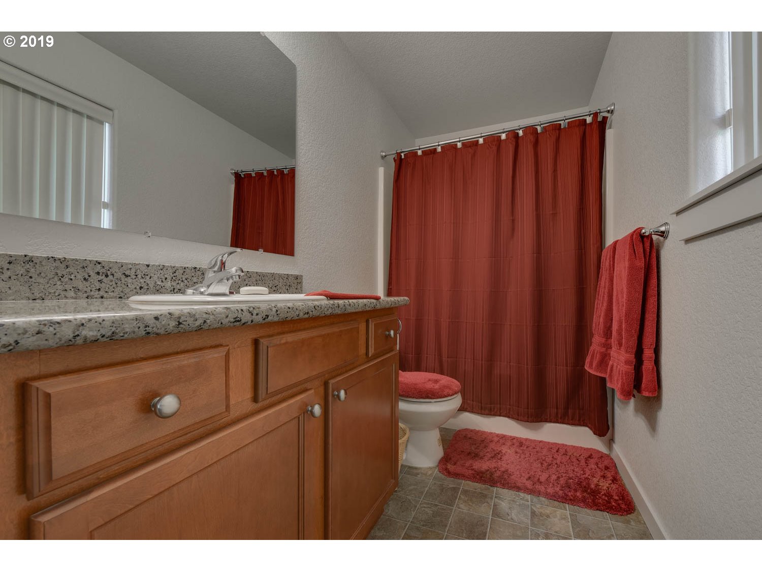 39573 Dubarko Road Sandy, OR 97055 - Photo 14 of 18 a bathroom with a sink and a mirror