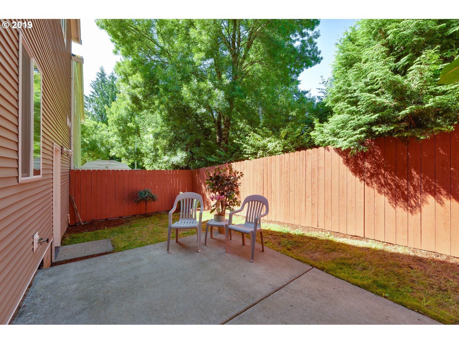39573 Dubarko Road Sandy, OR 97055 - Photo 18 of 18 a backyard of a house with yard and outdoor seating