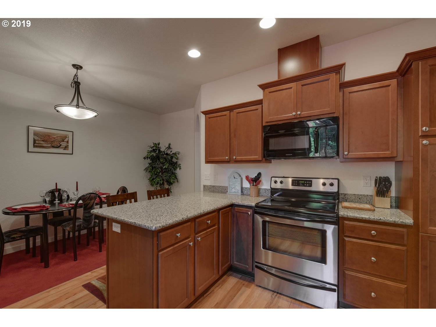 39573 Dubarko Road Sandy, OR 97055 - Photo 2 of 18 a kitchen with cabinets a sink and appliances