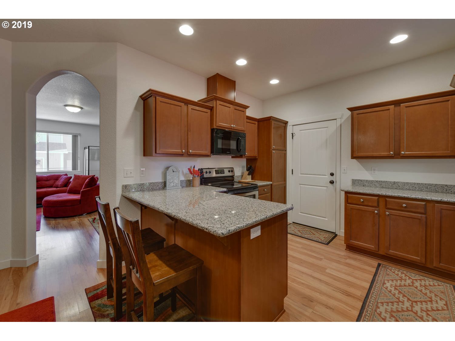 39573 Dubarko Road Sandy, OR 97055 - Photo 8 of 18 a kitchen with granite countertop a sink cabinets and stainless steel appliances