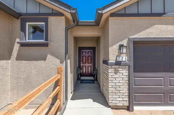 a view of a hallway with wooden floor windows and a livingroom