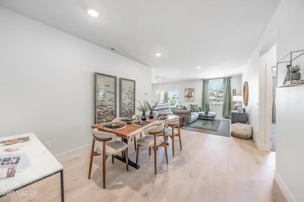a view of a dining room with furniture window and wooden floor