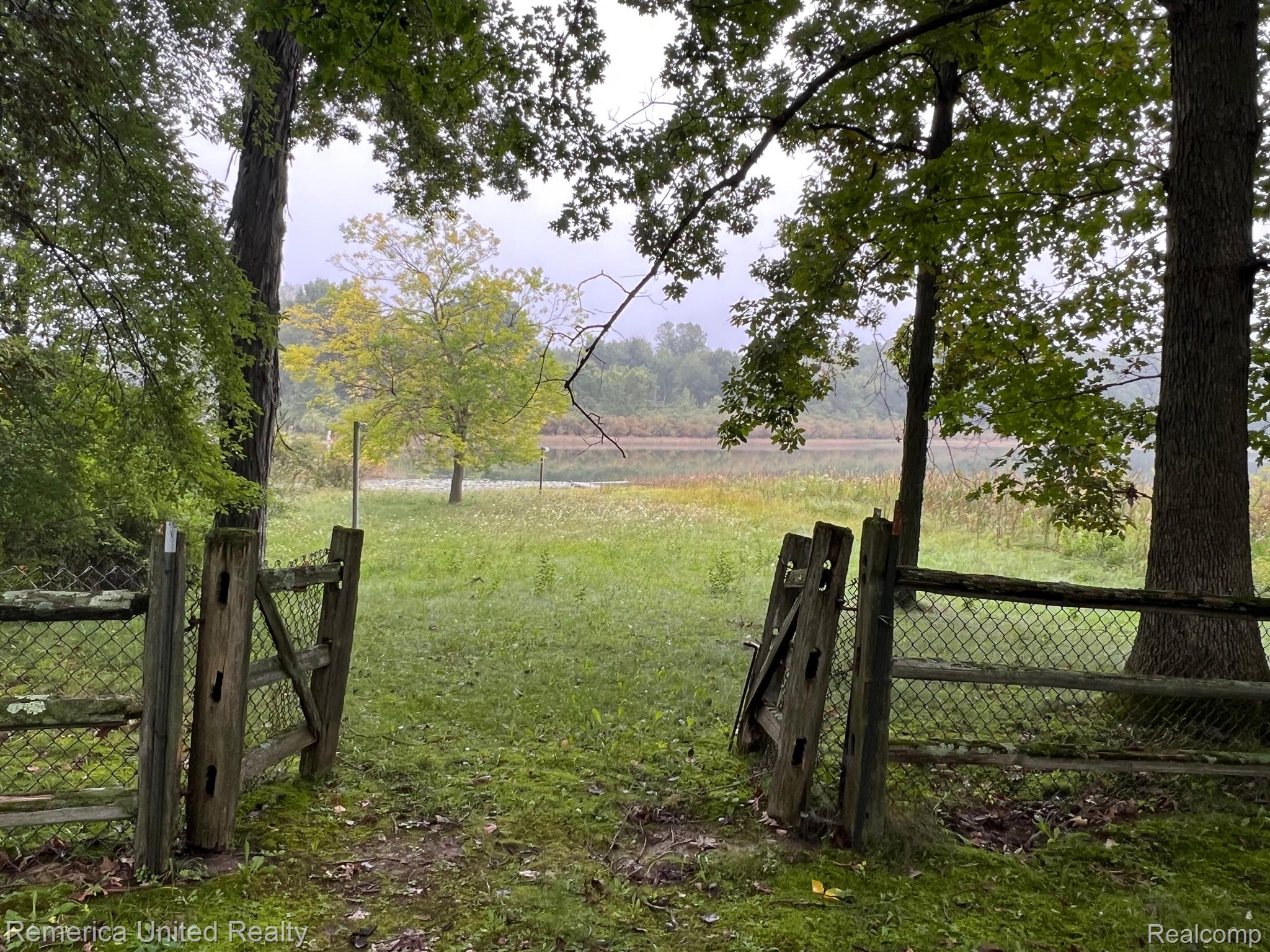 3340 Musson Road Howell, MI 48855 - Photo 28 of 45 Fence to lake/pond