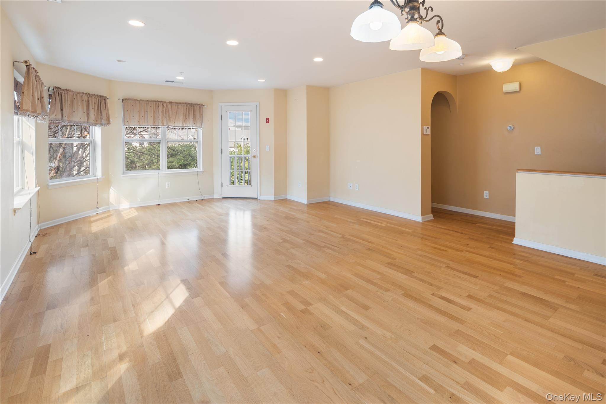 121 Northview Court Peekskill, NY 10566 - Photo 3 of 30 Natural light floods the room from oversize windows on multiple exposures