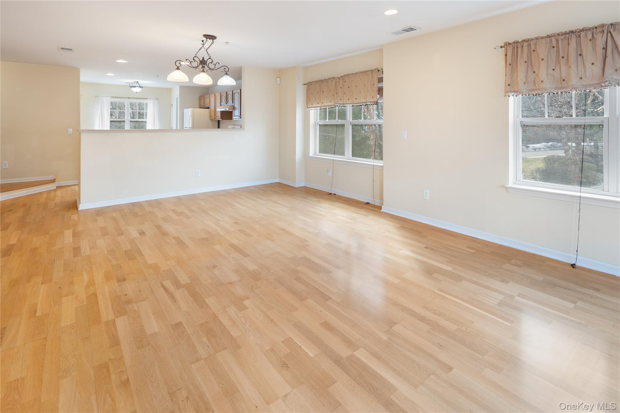 121 Northview Court Peekskill, NY 10566 - Photo 5 of 30 living room flowing seamlessly into spacious kitchen