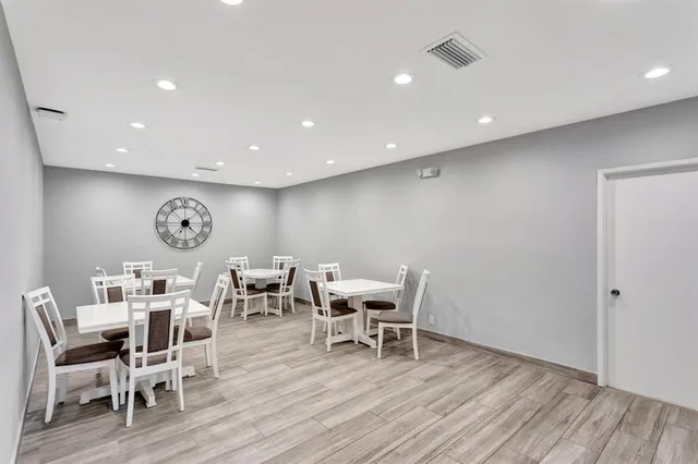 a view of backyard with swimming pool and outdoor seating