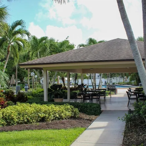 a view of a patio with a table and chairs