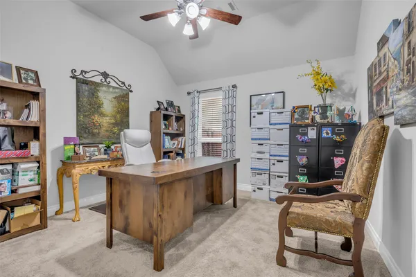 a view of a workspace with furniture and toys