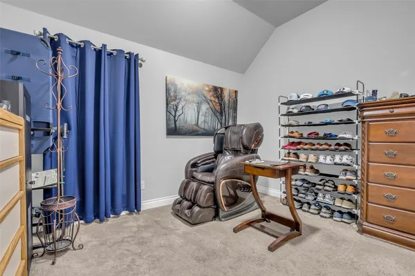 a view of a storage & utility room with racks shoes