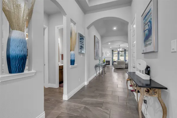 a view of a hallway with seating area