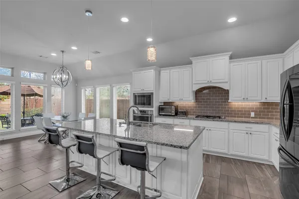 a kitchen with counter space cabinets and appliances