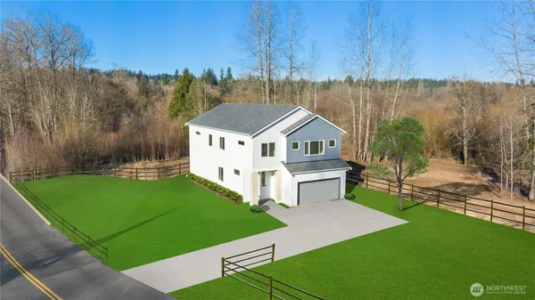 a view of a house with a yard