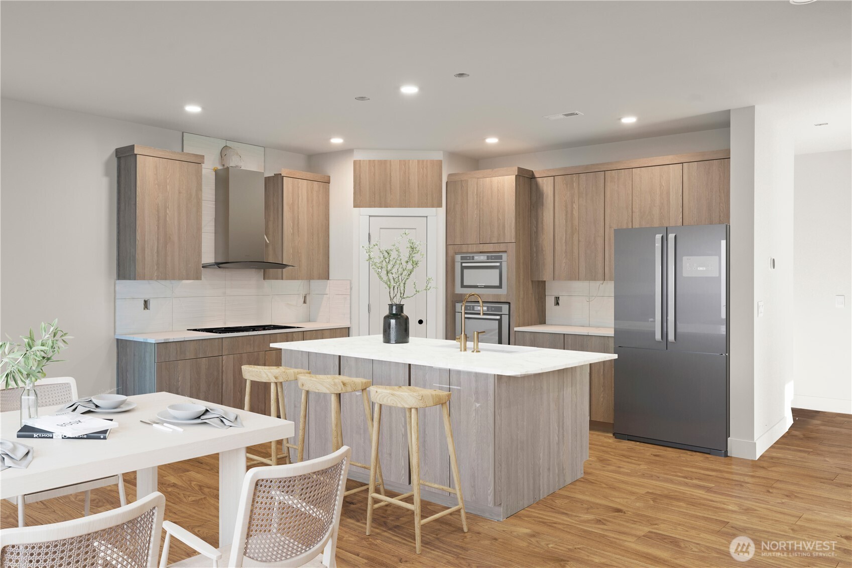 1729 214th Street Southeast Bothell, WA 98021 - Photo 5 of 8 a large kitchen with kitchen island a stove a sink a refrigerator and white cabinets with wooden floor