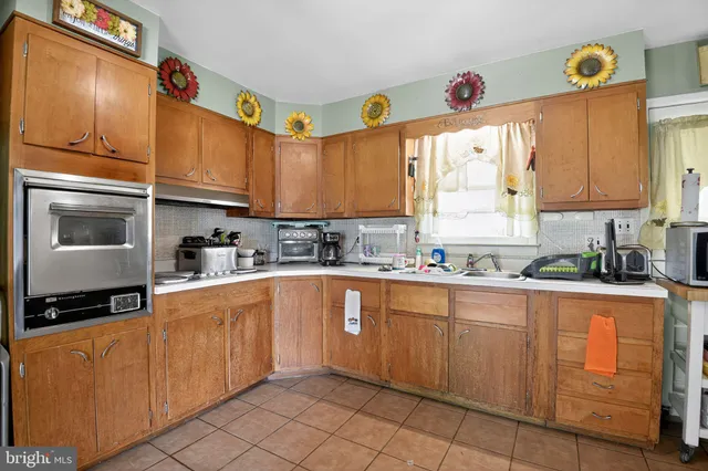 a bedroom with two beds and a window